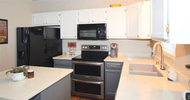 kitchen with sink, gray cabinetry, black appliances, a textured ceiling, and white cabinets