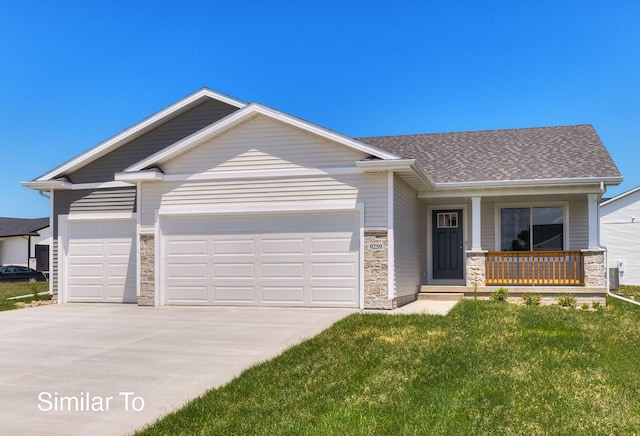 view of front of house featuring a garage, a front lawn, and a porch