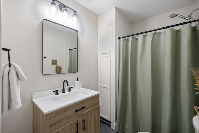 bathroom with a shower with curtain, vanity, and toilet