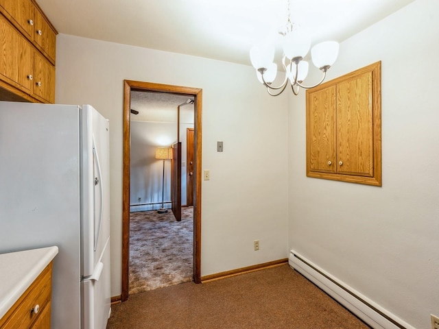 interior space featuring light carpet, a baseboard heating unit, an inviting chandelier, and refrigerator