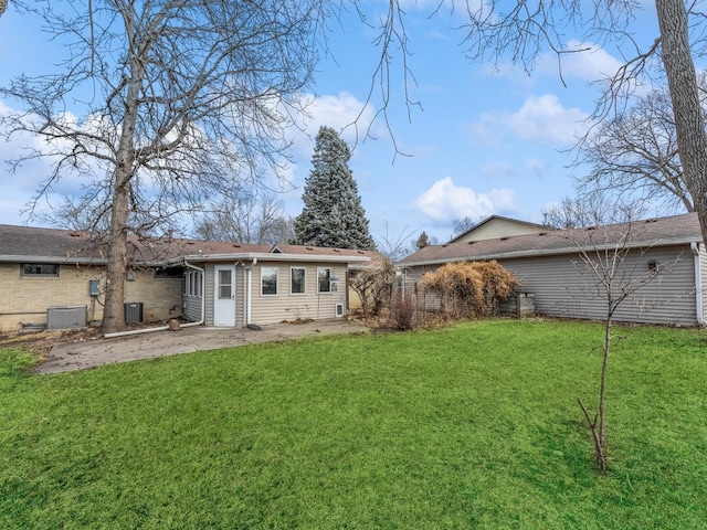 back of house featuring a yard and a patio area