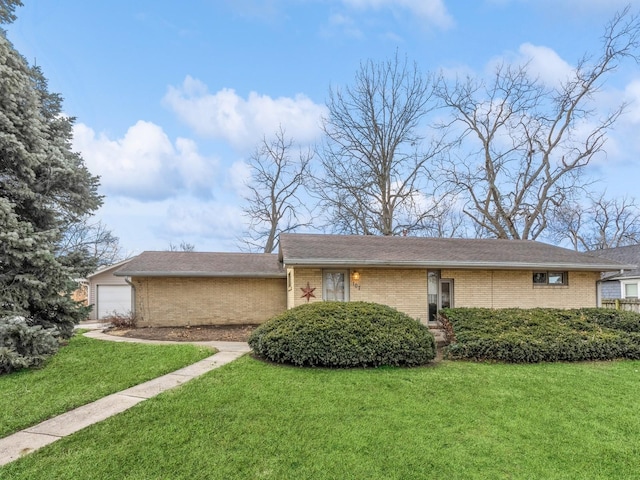 view of front of home with a garage and a front yard