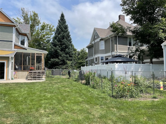 view of yard with a sunroom