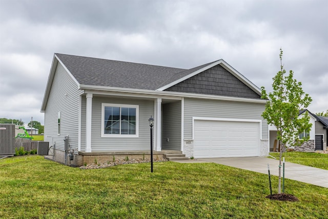 6433 NE 11th Ct, Des Moines, IA 50313 - view of front of home featuring an attached garage, driveway, a shingled roof, and cooling unit