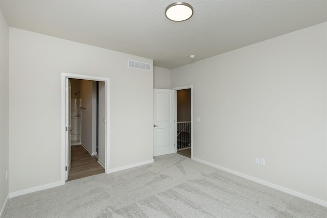 6433 NE 11th Ct, Des Moines, IA 50313 - unfurnished bedroom featuring carpet flooring and baseboards