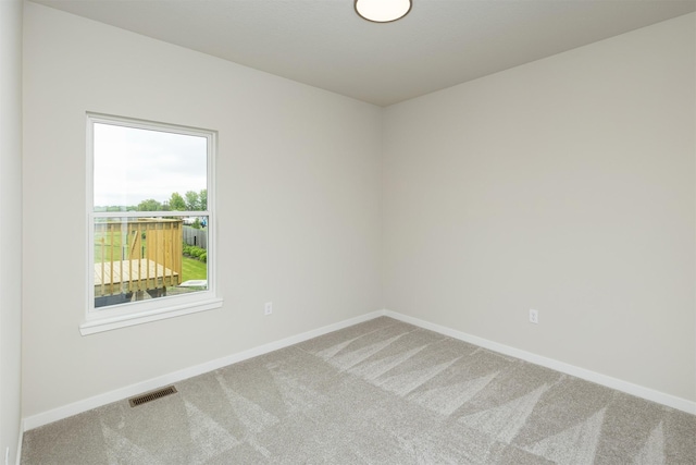 6433 NE 11th Ct, Des Moines, IA 50313 - unfurnished room featuring carpet flooring and baseboards