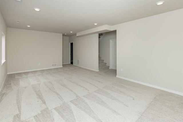 6433 NE 11th Ct, Des Moines, IA 50313 - unfurnished room with recessed lighting, light carpet, stairway, and baseboards