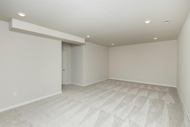 6433 NE 11th Ct, Des Moines, IA 50313 - empty room with light carpet, recessed lighting, and baseboards