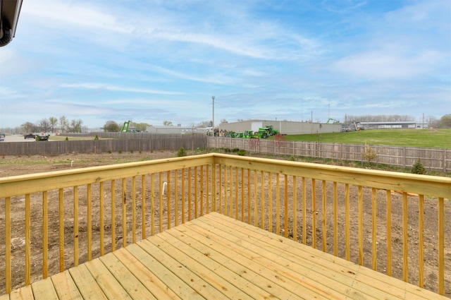 wooden terrace featuring a fenced backyard