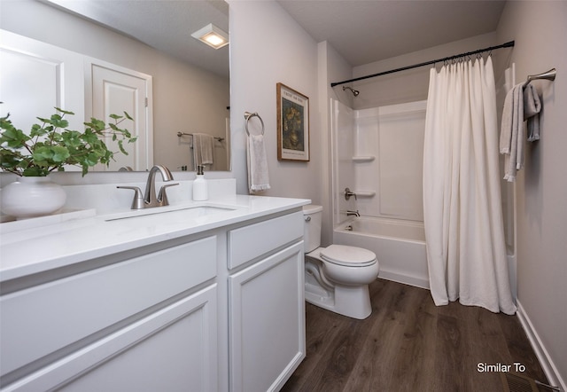 full bathroom with vanity, wood-type flooring, toilet, and shower / bath combo with shower curtain