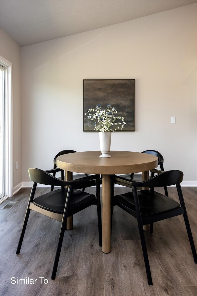 dining area featuring hardwood / wood-style flooring