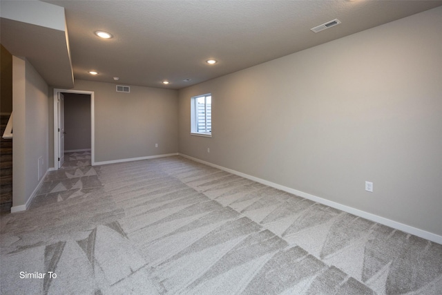 spare room with light colored carpet