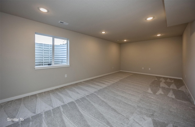 6443 NE 11th Ct, Des Moines, IA 50313 - carpeted spare room featuring baseboards and recessed lighting