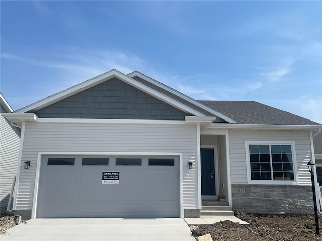 6443 NE 11th Ct, Des Moines, IA 50313 - view of front of home with driveway and an attached garage
