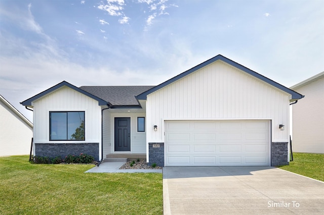 6423 NE 11th Ct, Des Moines, IA 50313 - view of front of house featuring stone siding, driveway, a front yard, a garage, and board and batten siding