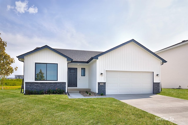 view of front of home featuring a garage and a front lawn