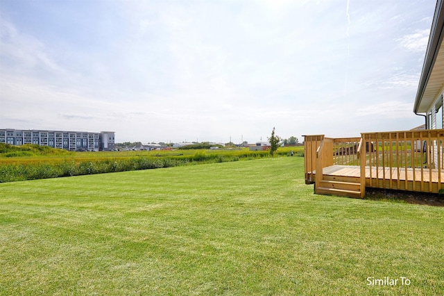 view of yard featuring a wooden deck