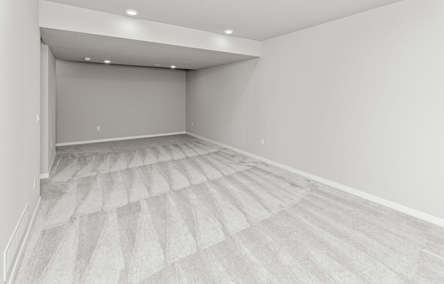 6423 NE 11th Ct, Des Moines, IA 50313 - spare room with carpet flooring, baseboards, and recessed lighting