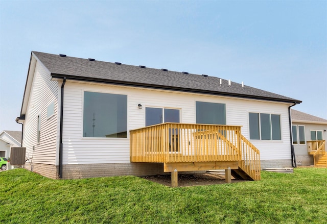 6423 NE 11th Ct, Des Moines, IA 50313 - back of property featuring a deck, stairs, a lawn, and a shingled roof