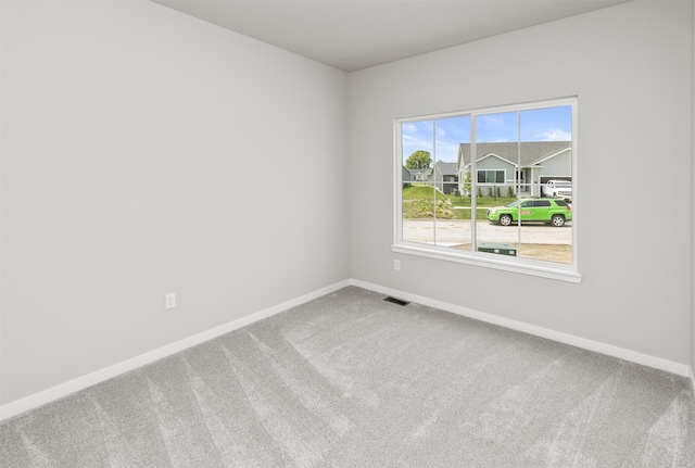 6423 NE 11th Ct, Des Moines, IA 50313 - carpeted empty room featuring baseboards