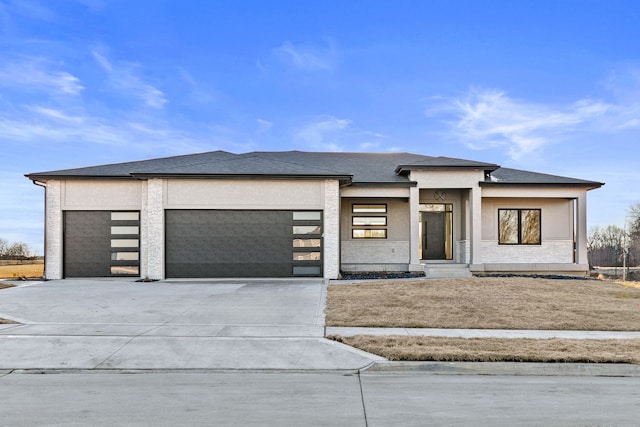 prairie-style home featuring a garage