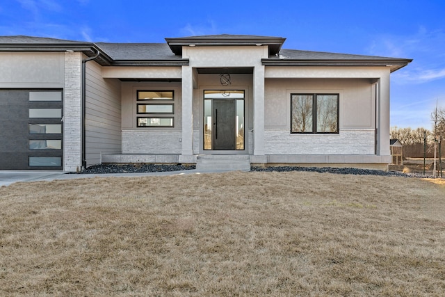 entrance to property with a yard