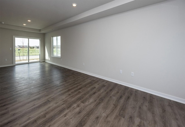 unfurnished room featuring baseboards, recessed lighting, and dark wood-style floors