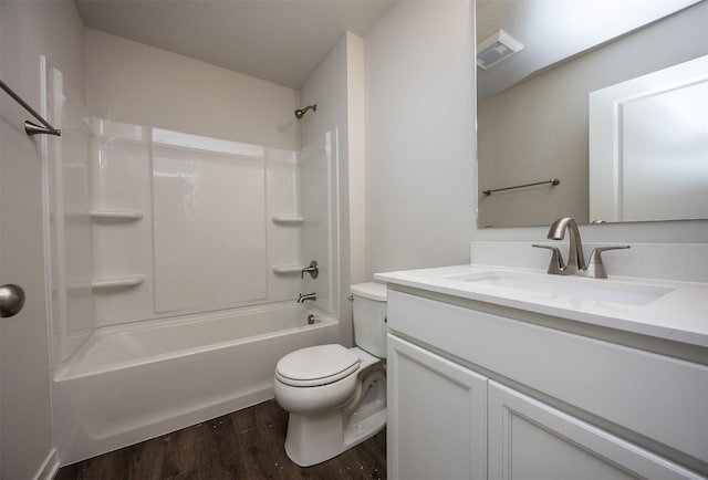 full bath with washtub / shower combination, wood finished floors, visible vents, toilet, and vanity