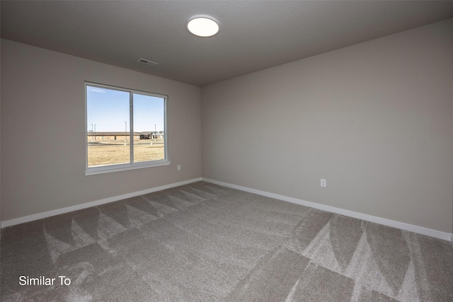 unfurnished room featuring carpet flooring