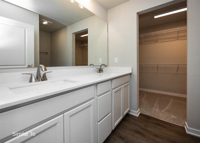 bathroom featuring vanity and hardwood / wood-style flooring