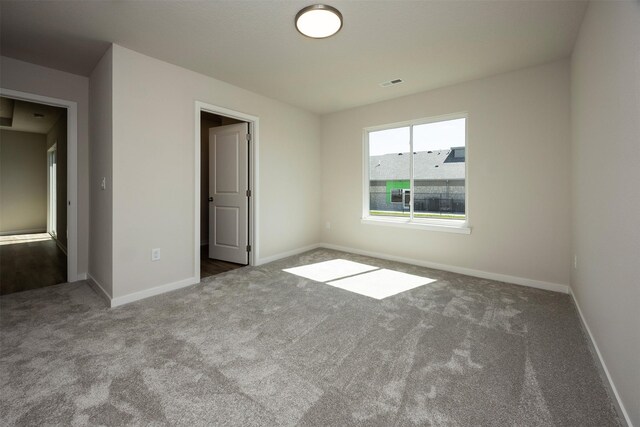 2228 Legacy Dr, Norwalk, IA 50211 - unfurnished bedroom featuring carpet floors and baseboards