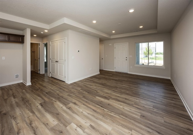2228 Legacy Dr, Norwalk, IA 50211 - unfurnished room featuring wood finished floors, baseboards, a tray ceiling, and recessed lighting