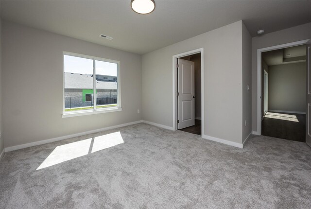 2232 Legacy Dr, Norwalk, IA 50211 - unfurnished bedroom with carpet floors and baseboards