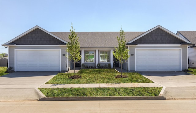 2232 Legacy Dr, Norwalk, IA 50211 - view of front facade featuring driveway, an attached garage, and a front lawn