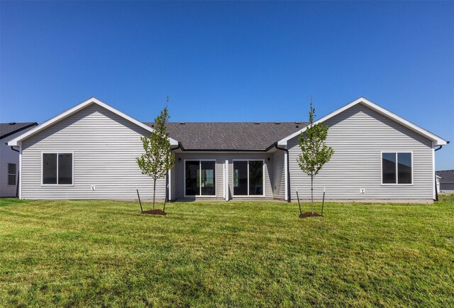 2232 Legacy Dr, Norwalk, IA 50211 - back of house featuring a lawn and roof with shingles