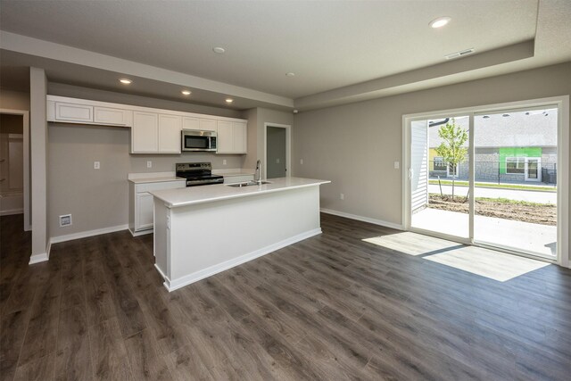 2232 Legacy Dr, Norwalk, IA 50211 - kitchen featuring stainless steel appliances, a sink, baseboards, white cabinets, and recessed lighting