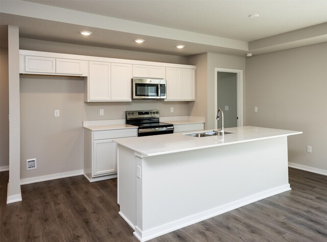 2232 Legacy Dr, Norwalk, IA 50211 - kitchen featuring stainless steel appliances, a sink, white cabinets, recessed lighting, and baseboards
