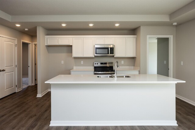 2232 Legacy Dr, Norwalk, IA 50211 - kitchen with appliances with stainless steel finishes, a sink, dark wood-style flooring, baseboards, and recessed lighting