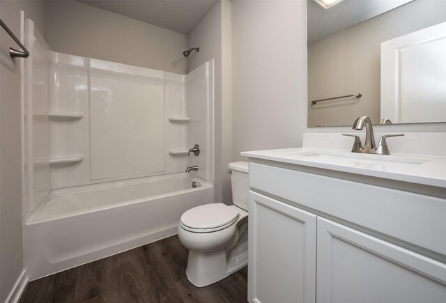2232 Legacy Dr, Norwalk, IA 50211 - bathroom featuring wood finished floors, toilet, vanity, and washtub / shower combination