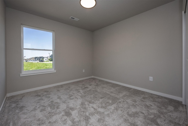 2232 Legacy Dr, Norwalk, IA 50211 - spare room featuring carpet flooring and baseboards