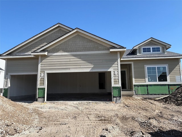 view of front of house with an attached garage and driveway