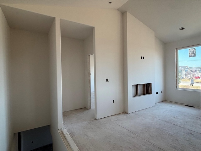 unfurnished living room with visible vents and a fireplace