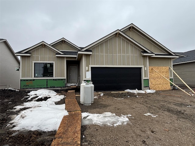 view of front of property featuring an attached garage and board and batten siding