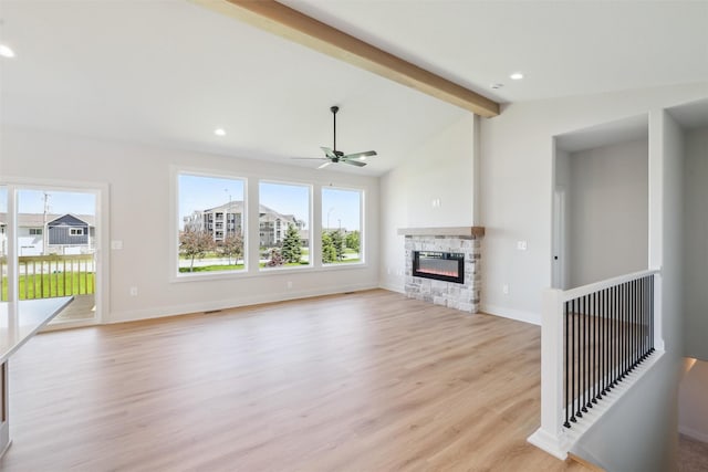 unfurnished living room with light wood finished floors, plenty of natural light, ceiling fan, a fireplace, and recessed lighting