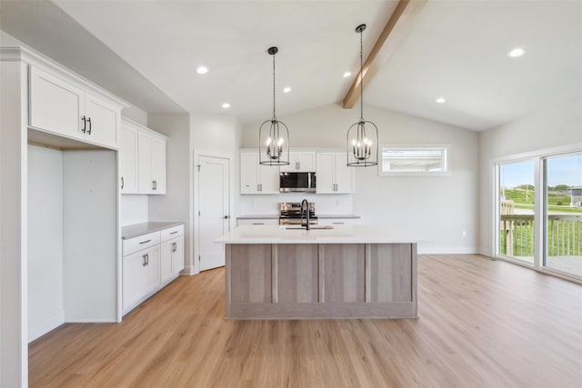 kitchen featuring appliances with stainless steel finishes, light wood finished floors, a center island with sink, light countertops, and recessed lighting