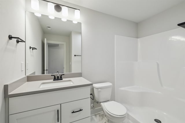 full bathroom featuring toilet, a shower, vanity, and marble look tile flooring
