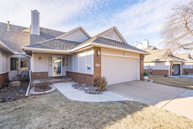 single story home featuring a garage and a front yard