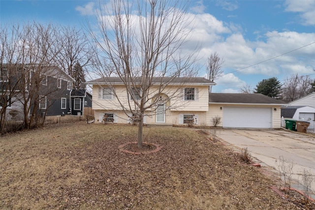 view of front of property with a garage and a front yard