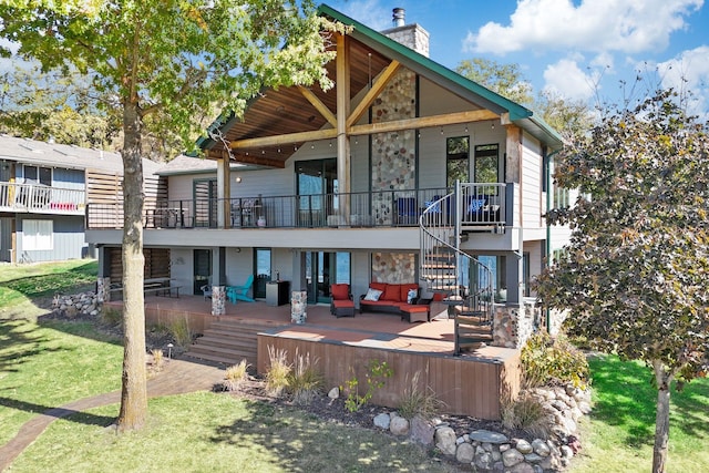 back of property with an outdoor hangout area and a patio area