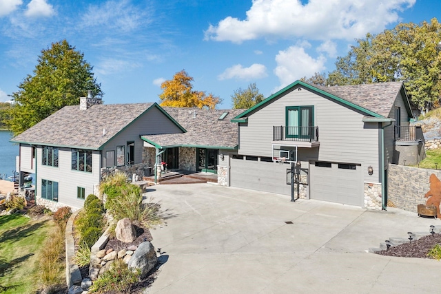 view of front of property with a garage and a balcony